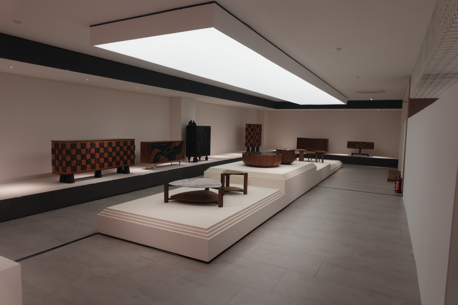 A collection of low stone coffee tables and sculptural side tables